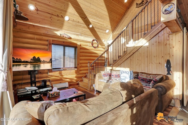19180 Beverly Ave, Chugiak, AK 99567 - living room featuring log walls, stairway, wood ceiling, wood finished floors, and a towering ceiling