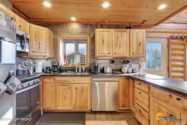 19180 Beverly Ave, Chugiak, AK 99567 - kitchen featuring stainless steel appliances, log walls, wooden ceiling, light wood finished floors, and light brown cabinetry