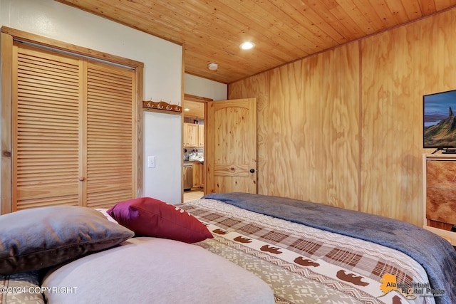 19180 Beverly Ave, Chugiak, AK 99567 - bedroom with wooden ceiling, a closet, wood walls, and recessed lighting