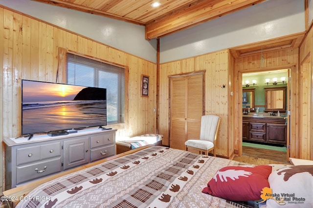 19180 Beverly Ave, Chugiak, AK 99567 - bedroom featuring wood walls, wood ceiling, a closet, and wood finished floors