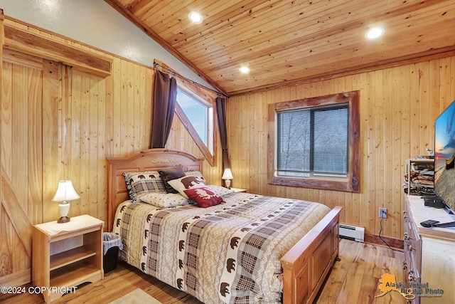 19180 Beverly Ave, Chugiak, AK 99567 - bedroom with light wood-style flooring, a baseboard radiator, wood walls, wooden ceiling, and recessed lighting