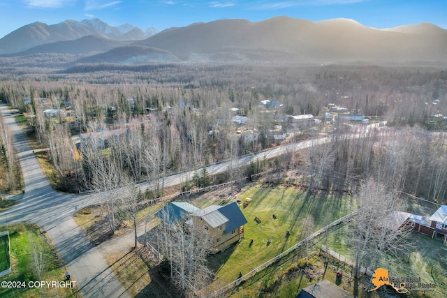 19180 Beverly Ave, Chugiak, AK 99567 - aerial view of property and surrounding area featuring a mountainous background and a heavily wooded area