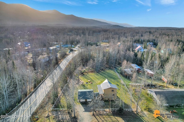 19180 Beverly Ave, Chugiak, AK 99567 - aerial view of a heavily wooded area and a mountain backdrop