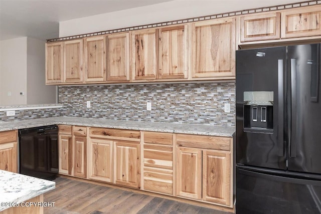 2429 Outside Blvd, North Pole, AK 99705 - kitchen featuring black appliances, backsplash, light stone counters, and light brown cabinetry