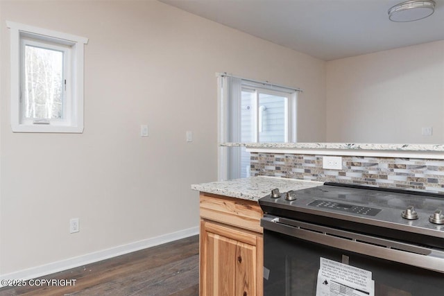2429 Outside Blvd, North Pole, AK 99705 - kitchen featuring range with electric stovetop, tasteful backsplash, dark wood-type flooring, and plenty of natural light
