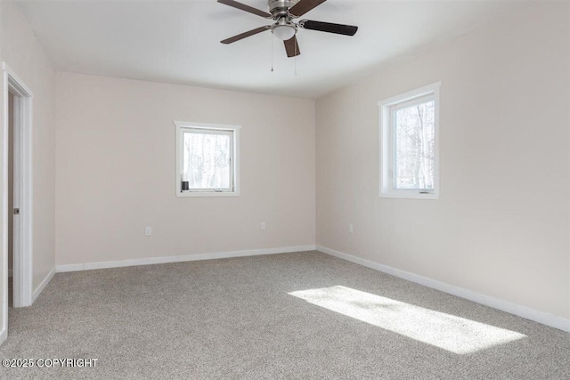 2429 Outside Blvd, North Pole, AK 99705 - empty room featuring healthy amount of natural light, carpet flooring, and ceiling fan