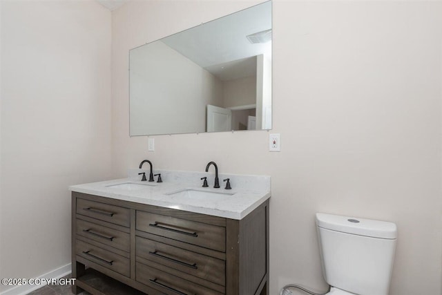 2429 Outside Blvd, North Pole, AK 99705 - bathroom featuring double vanity and toilet