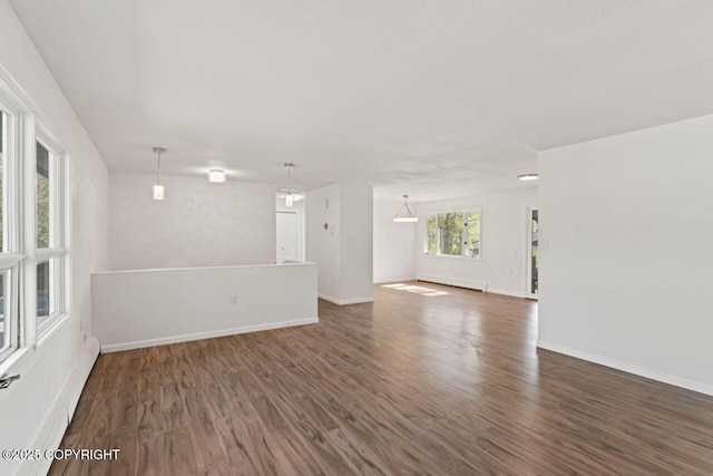 906 Lancaster Dr, Anchorage, AK 99503 - empty room featuring wood finished floors, baseboard heating, and baseboards