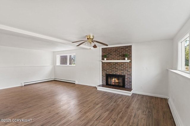 906 Lancaster Dr, Anchorage, AK 99503 - unfurnished living room with a baseboard heating unit, a fireplace, wood finished floors, and a ceiling fan