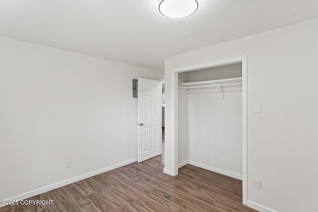 906 Lancaster Dr, Anchorage, AK 99503 - unfurnished bedroom with wood finished floors, baseboards, and a closet