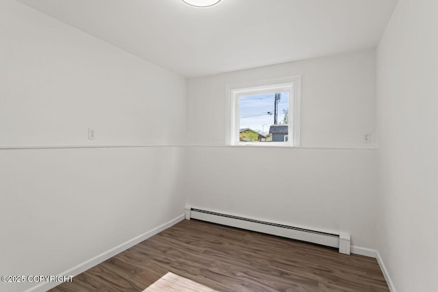 906 Lancaster Dr, Anchorage, AK 99503 - unfurnished room featuring baseboard heating, baseboards, and wood finished floors