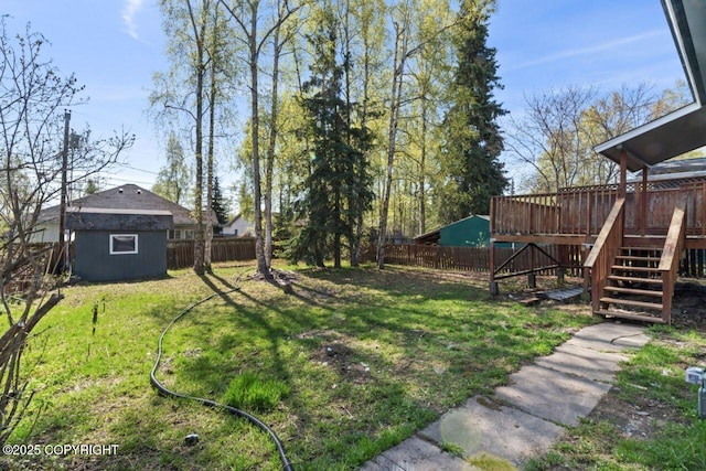 906 Lancaster Dr, Anchorage, AK 99503 - view of yard featuring stairs and a wooden deck