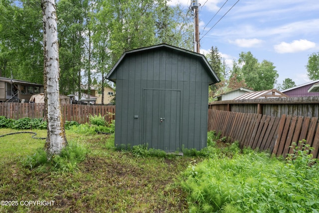 906 Lancaster Dr, Anchorage, AK 99503 - view of shed with a fenced backyard