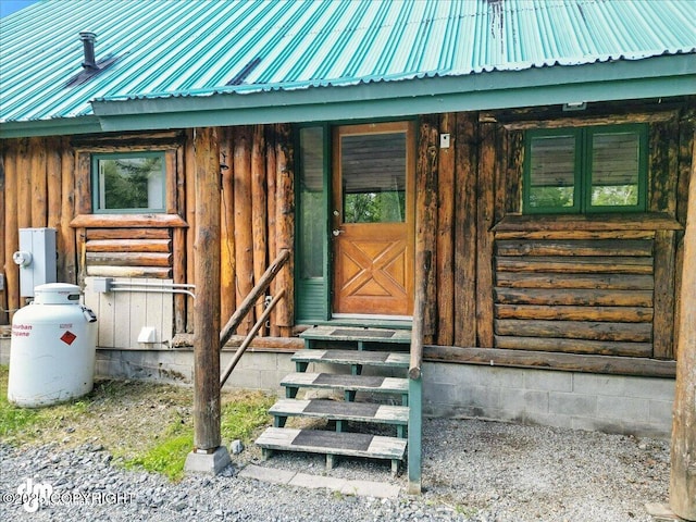 22032 Spring Creek Ln, Chugiak, AK 99567 - entrance to property with a metal roof and board and batten siding