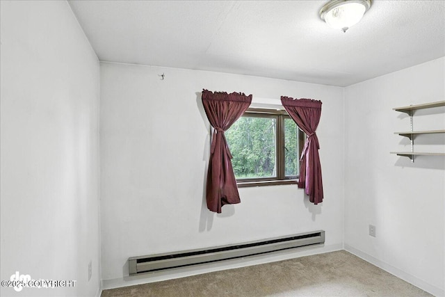 22032 Spring Creek Ln, Chugiak, AK 99567 - empty room featuring a baseboard heating unit and carpet floors