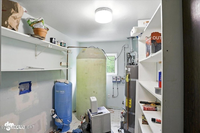 22032 Spring Creek Ln, Chugiak, AK 99567 - utility room featuring gas water heater