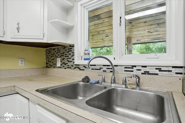 22032 Spring Creek Ln, Chugiak, AK 99567 - kitchen with white cabinets, tasteful backsplash, light countertops, and open shelves