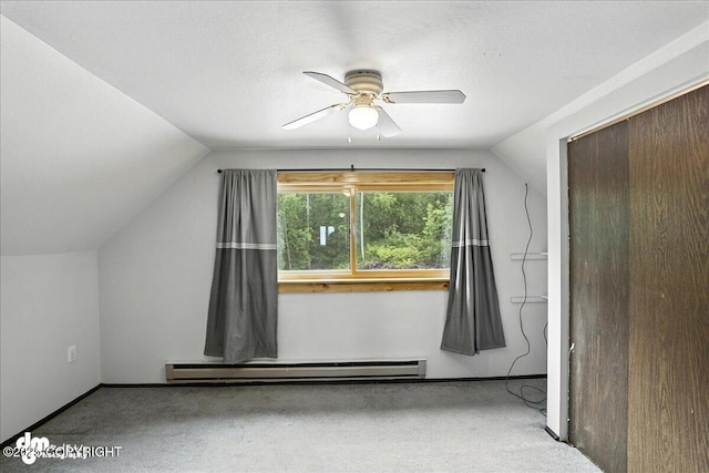 22032 Spring Creek Ln, Chugiak, AK 99567 - bonus room featuring a baseboard heating unit, vaulted ceiling, carpet, and a ceiling fan
