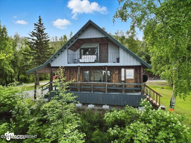 22032 Spring Creek Ln, Chugiak, AK 99567 - rear view of property with a porch
