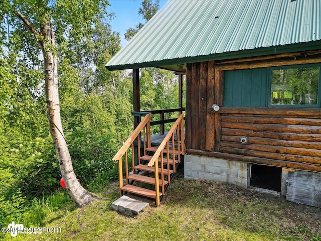 22032 Spring Creek Ln, Chugiak, AK 99567 - entrance to property with a metal roof and log exterior