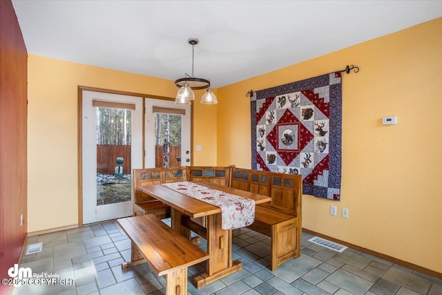 dining space with visible vents, french doors, and baseboards
