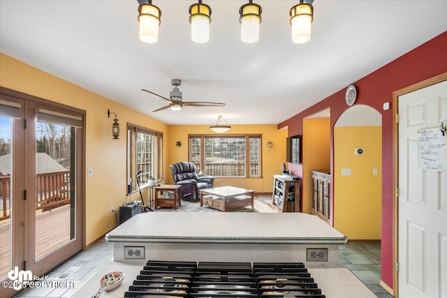 interior space featuring a healthy amount of sunlight and ceiling fan