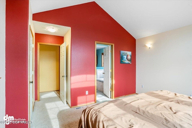 bedroom with lofted ceiling, light carpet, visible vents, and baseboards