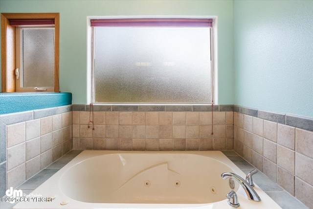 full bathroom featuring a jetted tub