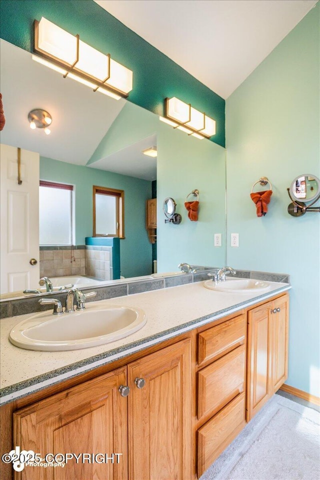 full bath featuring double vanity and a sink