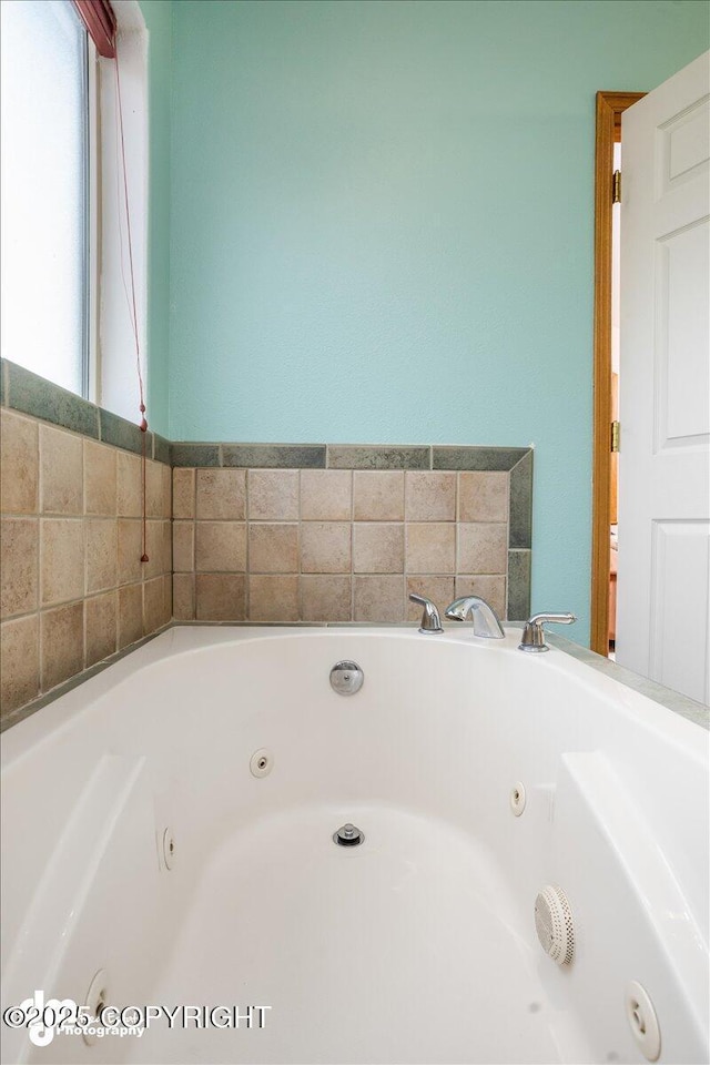 bathroom with a jetted tub