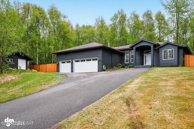 ranch-style home featuring driveway and an attached garage