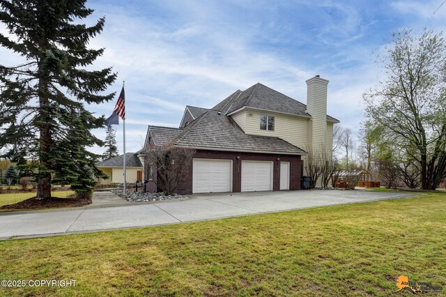 view of home's exterior with a chimney, a lawn, a garage, brick siding, and concrete driveway