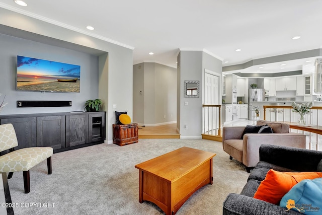 living area featuring ornamental molding, recessed lighting, light carpet, and baseboards