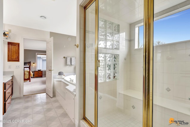 full bathroom featuring ensuite bathroom, a shower stall, a bath, and tile patterned flooring
