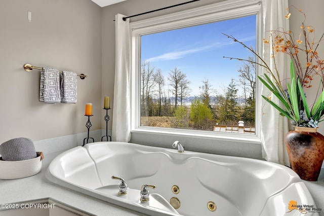 full bath featuring a whirlpool tub
