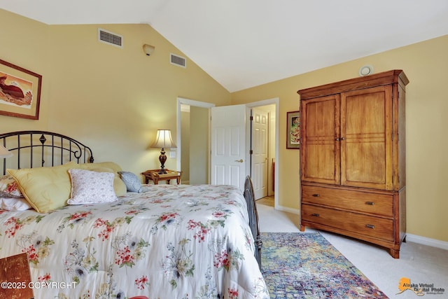 bedroom featuring lofted ceiling, light colored carpet, and baseboards