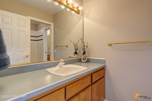 full bath with vanity and a shower