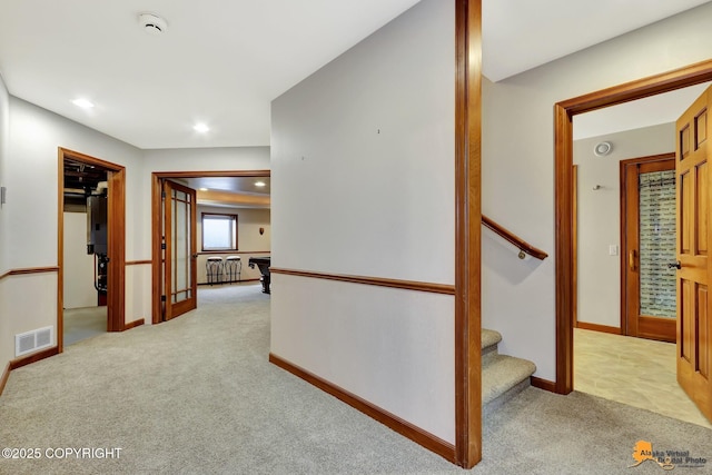 corridor with light carpet, stairway, recessed lighting, and baseboards