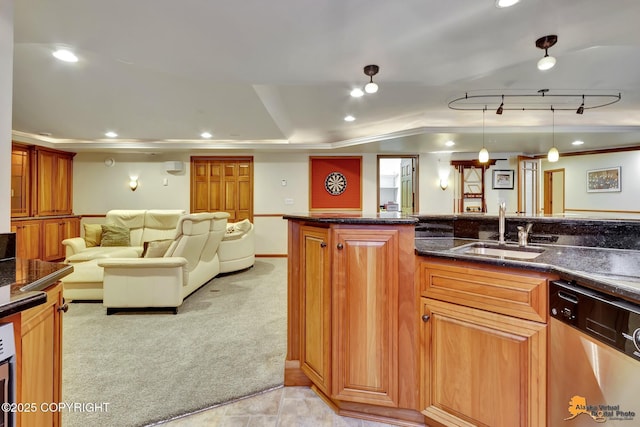 kitchen with dishwasher, a sink, light carpet, brown cabinetry, and ornamental molding