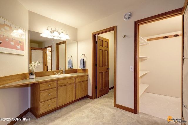 full bathroom featuring vanity and baseboards