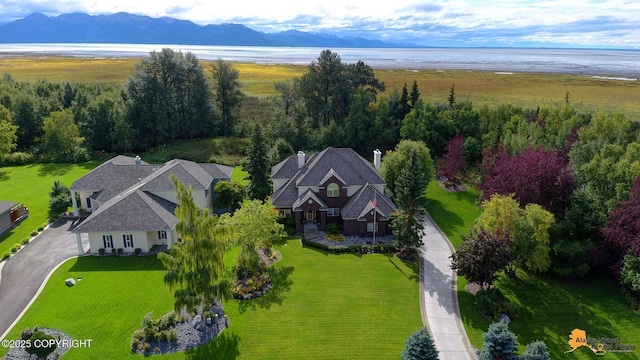 view of subject property featuring a water and mountain view