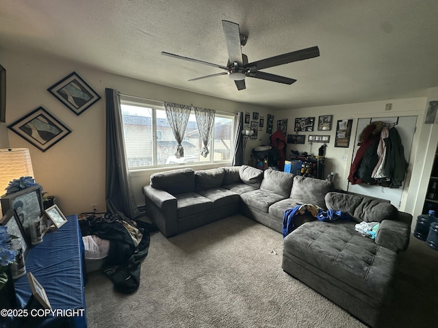 living area with ceiling fan, carpet floors, and a textured ceiling