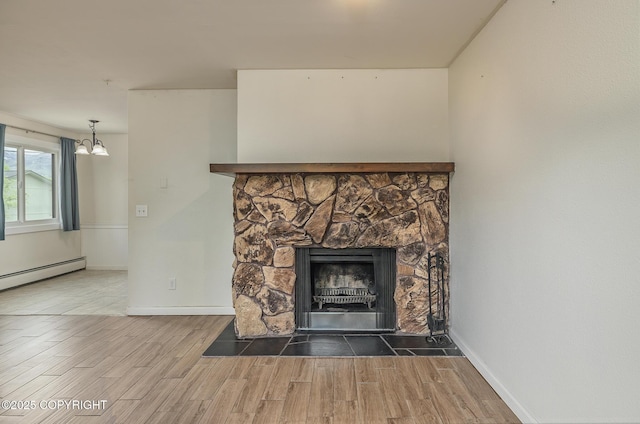 8516 Boundary Ave # E3, Anchorage, AK 99504 - detailed view of a chandelier, a stone fireplace, wood finished floors, and baseboards