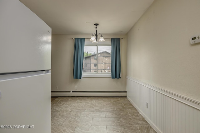 8516 Boundary Ave # E3, Anchorage, AK 99504 - unfurnished dining area with a baseboard radiator, a chandelier, and marble look tile flooring