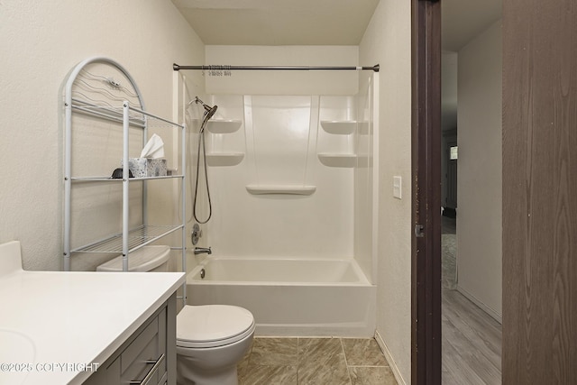 8516 Boundary Ave # E3, Anchorage, AK 99504 - bathroom with vanity, toilet, shower / washtub combination, and baseboards