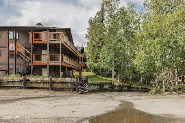 8516 Boundary Ave # E3, Anchorage, AK 99504 - view of front of home featuring stairs and a deck