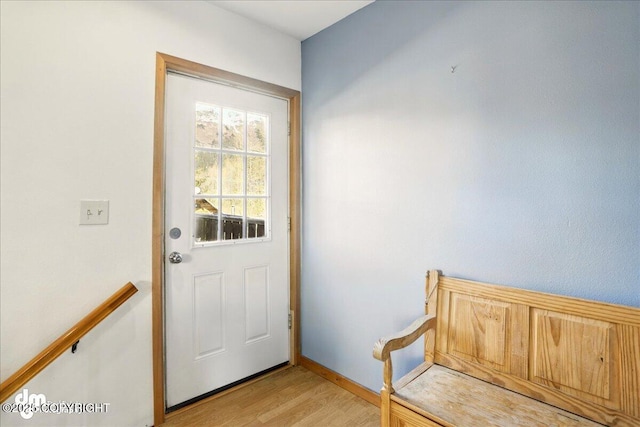 entryway featuring light wood-style flooring and baseboards