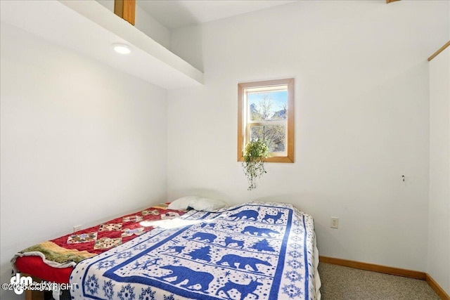 bedroom featuring carpet flooring and baseboards
