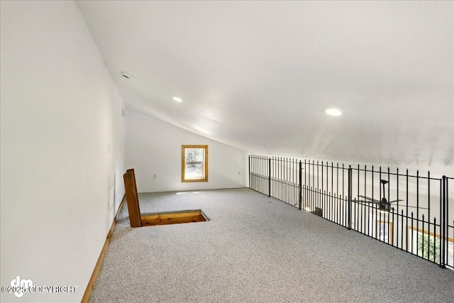 additional living space with carpet, lofted ceiling, recessed lighting, and baseboards