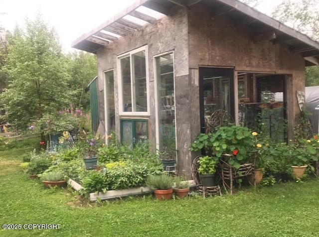 view of home's exterior featuring a yard and stucco siding